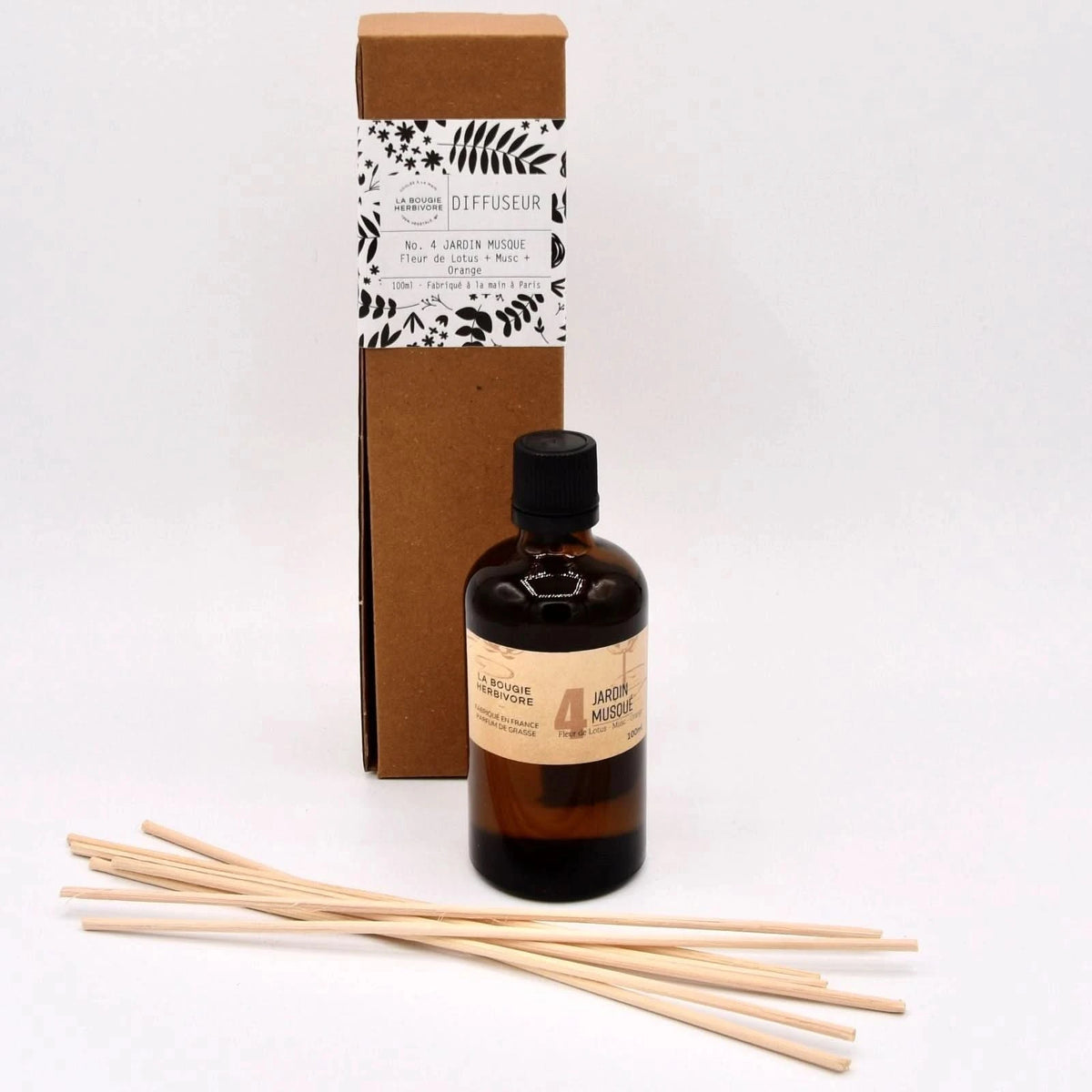 Diffuseur parfum musc et orange avec flacon en verre et bâtonnets en bois pour une ambiance parfumée