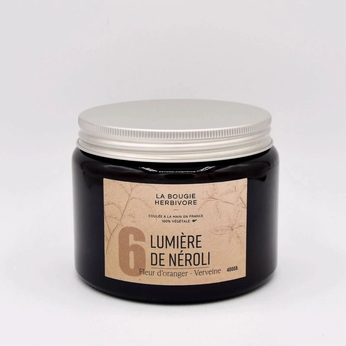 Bougie verveine fleur d'oranger La Bougie Herbivore dans un pot noir avec un couvercle argenté, 400g
